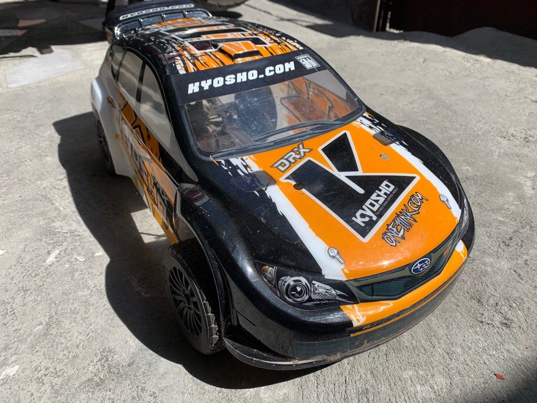 Kyosho DRX Subaru RC Car (Category: Remote Control Toys) located in Manila. Submitted by miah_collectiblesurplus (Listing ID 1418534990, Image 2). Description: 15,000 pesos Location: Valenzuela Kyosho DRX 1/9 Scale Subaru Impreza radio-controlled rally car Untested wala remote Pero working motor From Japan item as is.