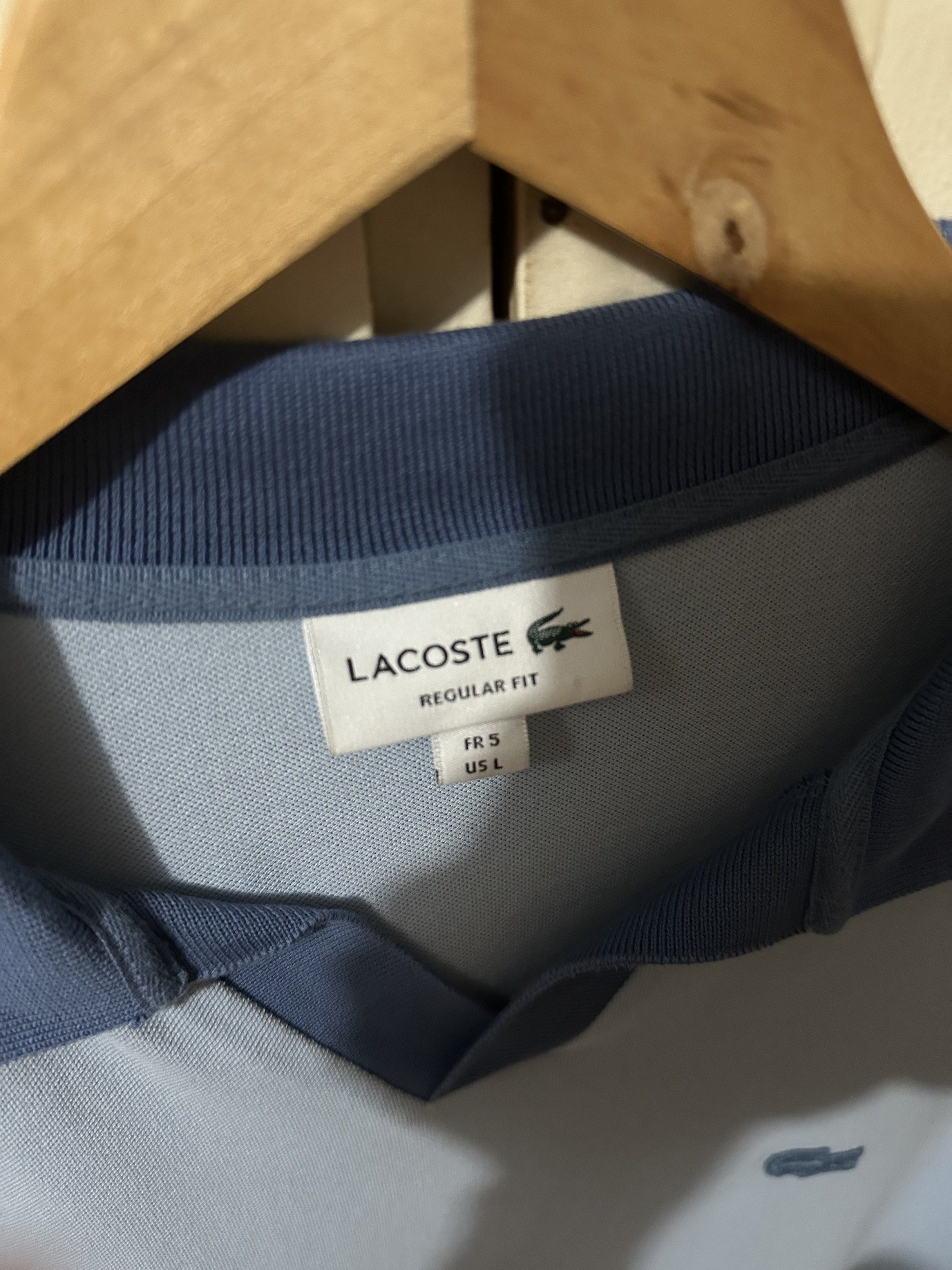 Lacoste Regular Fit Polo Shirt (Category: Tshirts & Polo Shirts ) located in Manila. Submitted by 4buying (Listing ID 1418416523, Image 3). Description: - Lacoste polo shirt - Light blue color - Size: L - Unique collar design - Iconic crocodile logo - Regular fit - 100% cotton - Darker blue collar and cuffs 27 x 22.
