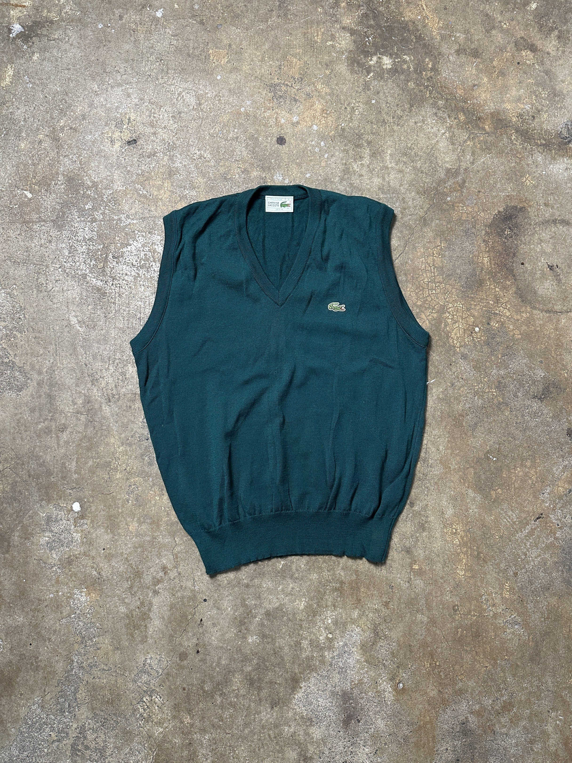 Lacoste V-Neck Vest (Category: Vests) located in Bacolod City. Submitted by thestitchph (Listing ID 1418446157, Image 1). Description: - Authentic Lacoste vest - Deep green color - Size 4 - Made in France - Pure new wool - Iconic Lacoste crocodile logo - "Chemise Lacoste Loisirs" item - V-neck design - Ribbed hem Size 4 21x26 Good condition .