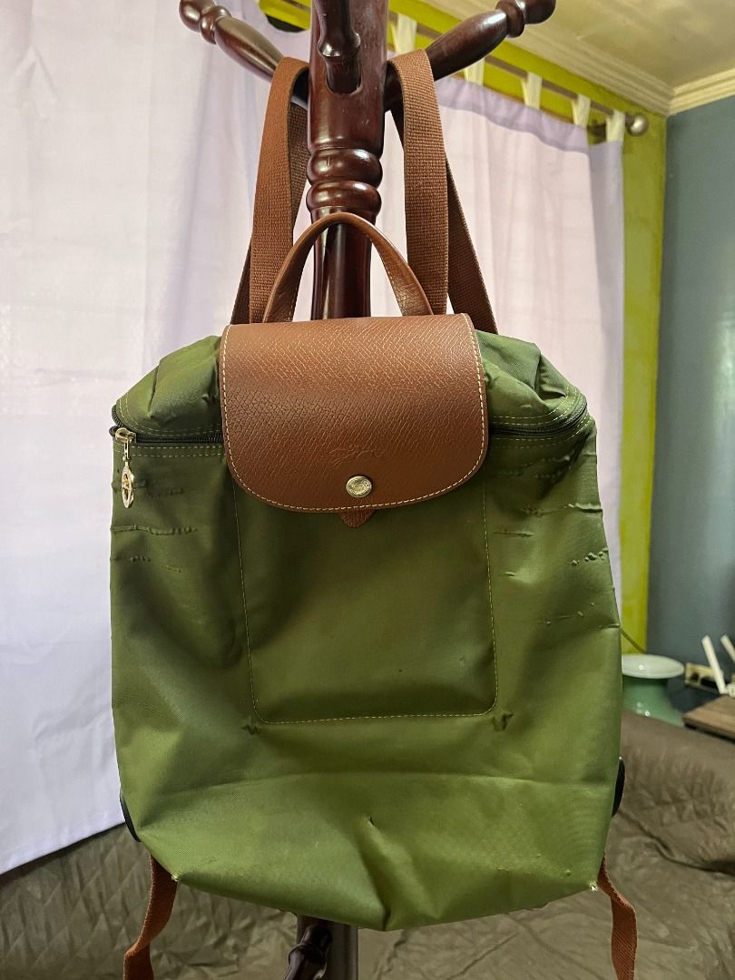 Longchamp Le Pliage Backpack Original - Green (Category: Luxury Bags & Wallets) located in Binan City. Submitted by geepch (Listing ID 1418481021, Image 3). Description: Longchamp Le Pliage Backpack Original Original price: Php 5,500 Selling price: Php 2,500 Bought: 2017 This is a preloved item, please set your expectation, item shows normal wear and tear through constant use..