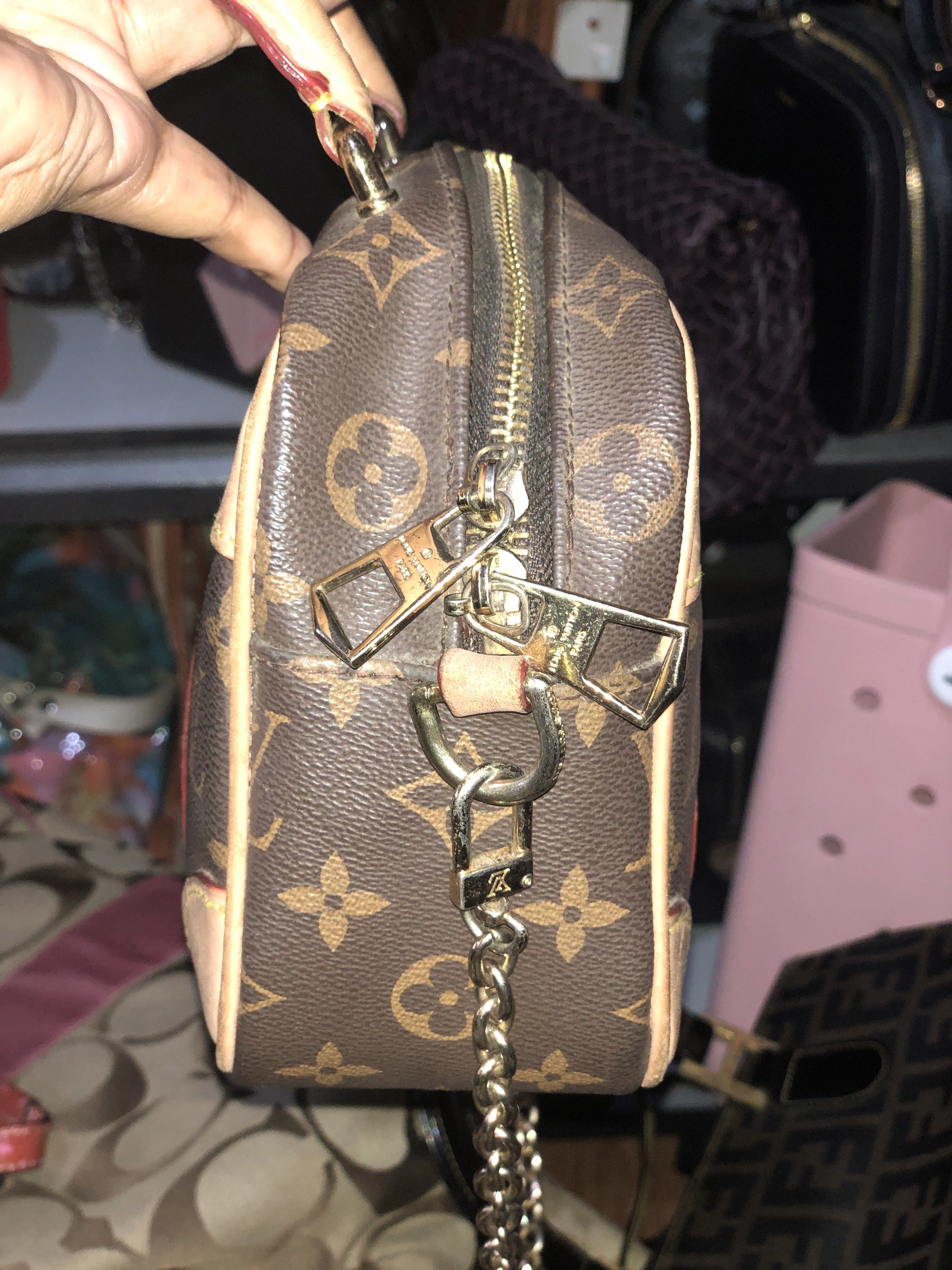 Louis Vuitton Mini Papillon Handbag (Category: Luxury Bags & Wallets) located in Davao. Submitted by deinlakarol19 (Listing ID 1418437191, Image 2). Description: - Authentic Louis Vuitton Mini Papillon - Iconic monogram canvas - Tan leather accents and handles - Gold-tone chain strap included - Brown fabric lining with interior pocket - Gold-toned zipper closure - Classic barrel shape.