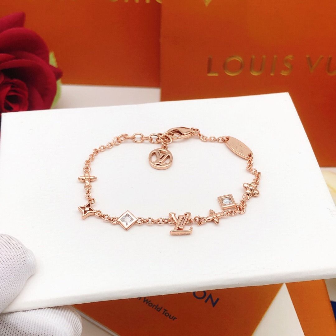 Louis Vuitton Monogram Bracelet (Category: Bracelets) located in Pateros City. Submitted by silvercat-dab8ef (Listing ID 1418573246, Image 2). Description: - Authentic Louis Vuitton bracelet - Features the classic monogram design - Rose gold color - Adorned with LV logo, flower, and square charms - Comes with original branded box - Perfect for adding a touch of luxury to any look.