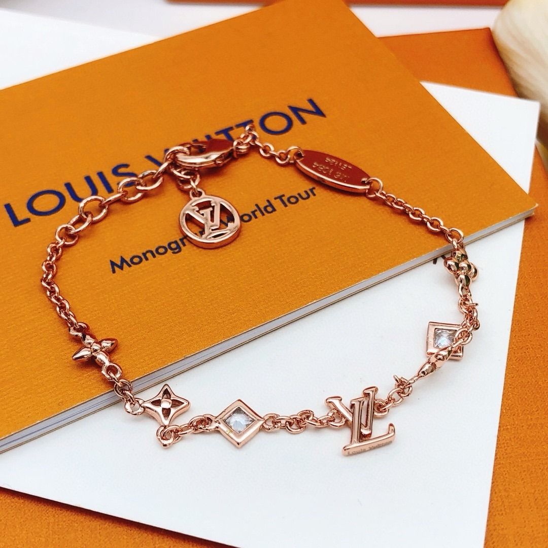 Louis Vuitton Monogram Bracelet (Category: Bracelets) located in Pateros City. Submitted by silvercat-dab8ef (Listing ID 1418573246, Image 3). Description: - Authentic Louis Vuitton bracelet - Features the classic monogram design - Rose gold color - Adorned with LV logo, flower, and square charms - Comes with original branded box - Perfect for adding a touch of luxury to any look.