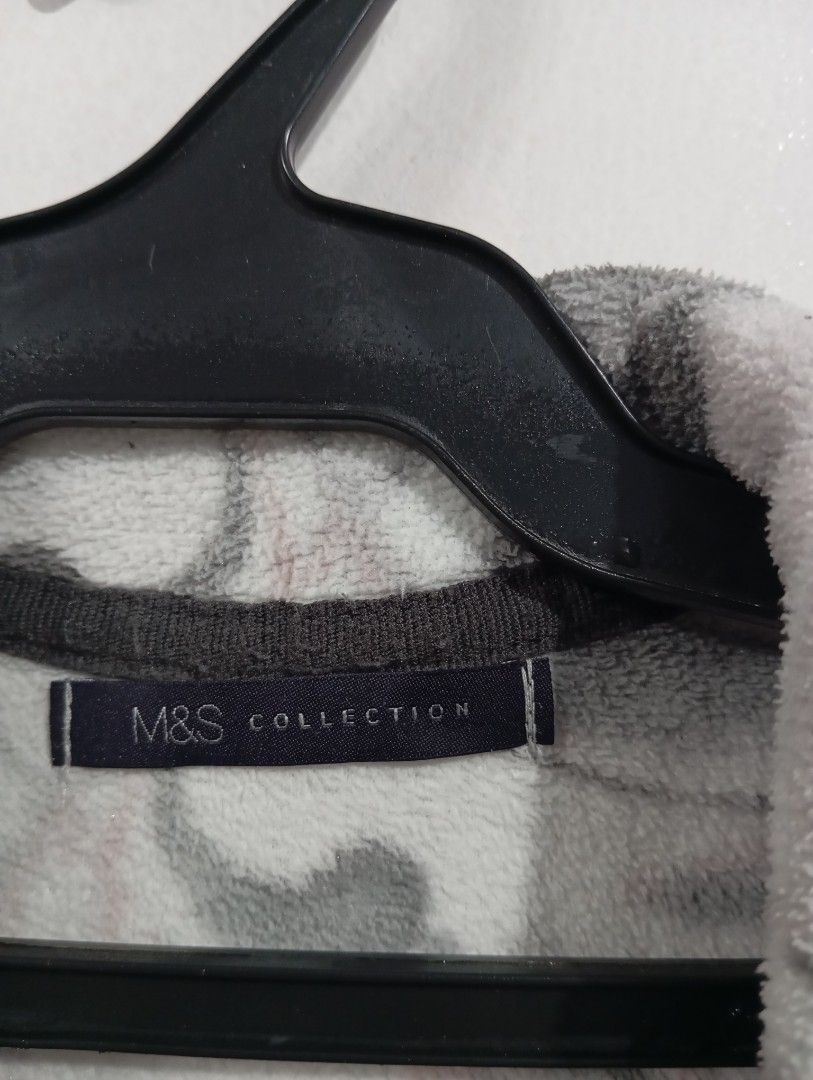 Marks & Spencer Collection Fleece Jacket M&S (Category: Coats, Jackets and Outerwear) located in Muntinlupa City. Submitted by challasy (Listing ID 1418573513, Image 3). Description: M&S Collection fleece jacket features a unique pattern in shades of gray, pink, and white. It has a full zip closure, two front pockets, and a high collar. The jacket is a UK size 8 and EUR size 36. It is made of a soft fleece material, perfect for cooler weather..