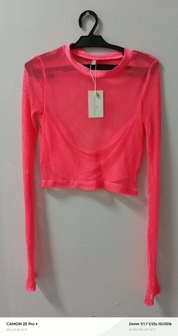 Neon Pink Mesh Top (Category: Sleeveless) located in Quezon City. Submitted by sheila0721 (Listing ID 1418465627, Image 1). Description: - Neon pink mesh crop top - Long sleeves - Round neckline - Cropped style - Lightweight and breathable - Includes tag.