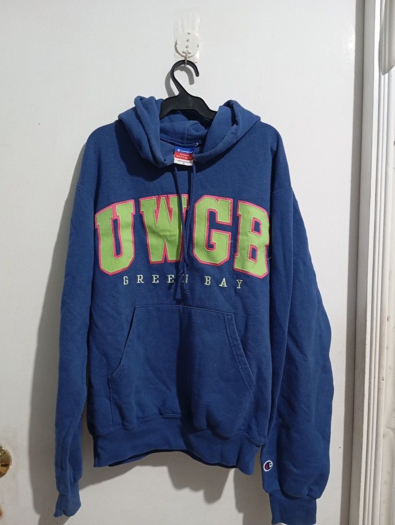 Champion Blue Jacket Hoodie (Category: Coats, Jackets and Outerwear) located in Muntinlupa City. Submitted by challasy (Listing ID 1418519911, Image 1). Description: - Champion hoodie - UWGB Green Bay print - Blue color - Size: Small (fits Small to Medium frame) - Features front pocket and drawstring hood.
