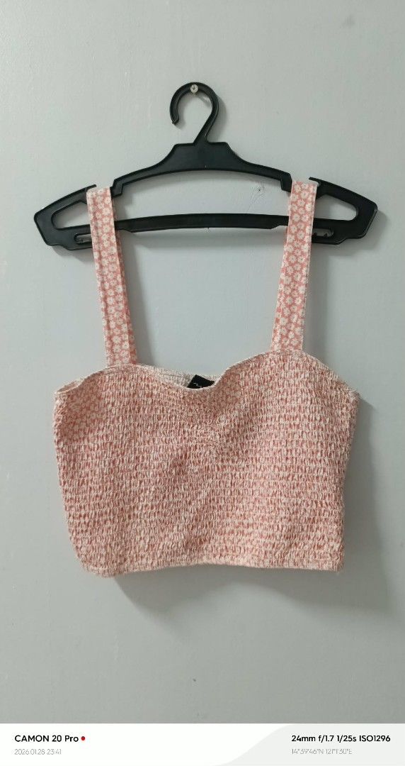 Pink Crop Top (Category: Others Tops) located in Quezon City. Submitted by sheila0721 (Listing ID 1418463302, Image 1). Description: - Pink crop top - Textured design - Wide straps - Scoop neckline - Comfortable fit - Perfect for high-waisted bottoms - Versatile for various occasions.