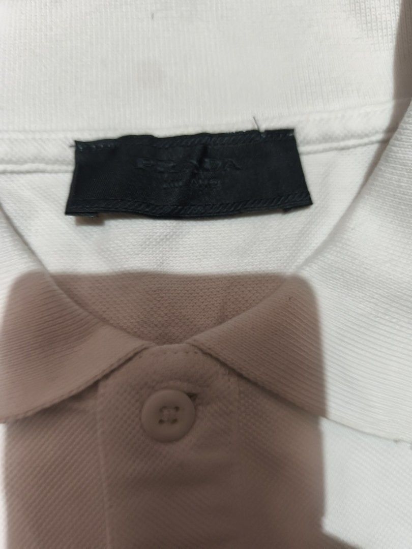 Prada White Polo Shirt (Category: Luxury Apparel) located in Manila. Submitted by rms.thrift (Listing ID 1418528582, Image 2). Description: prada polo shirt complete all tags no issue 27x22.