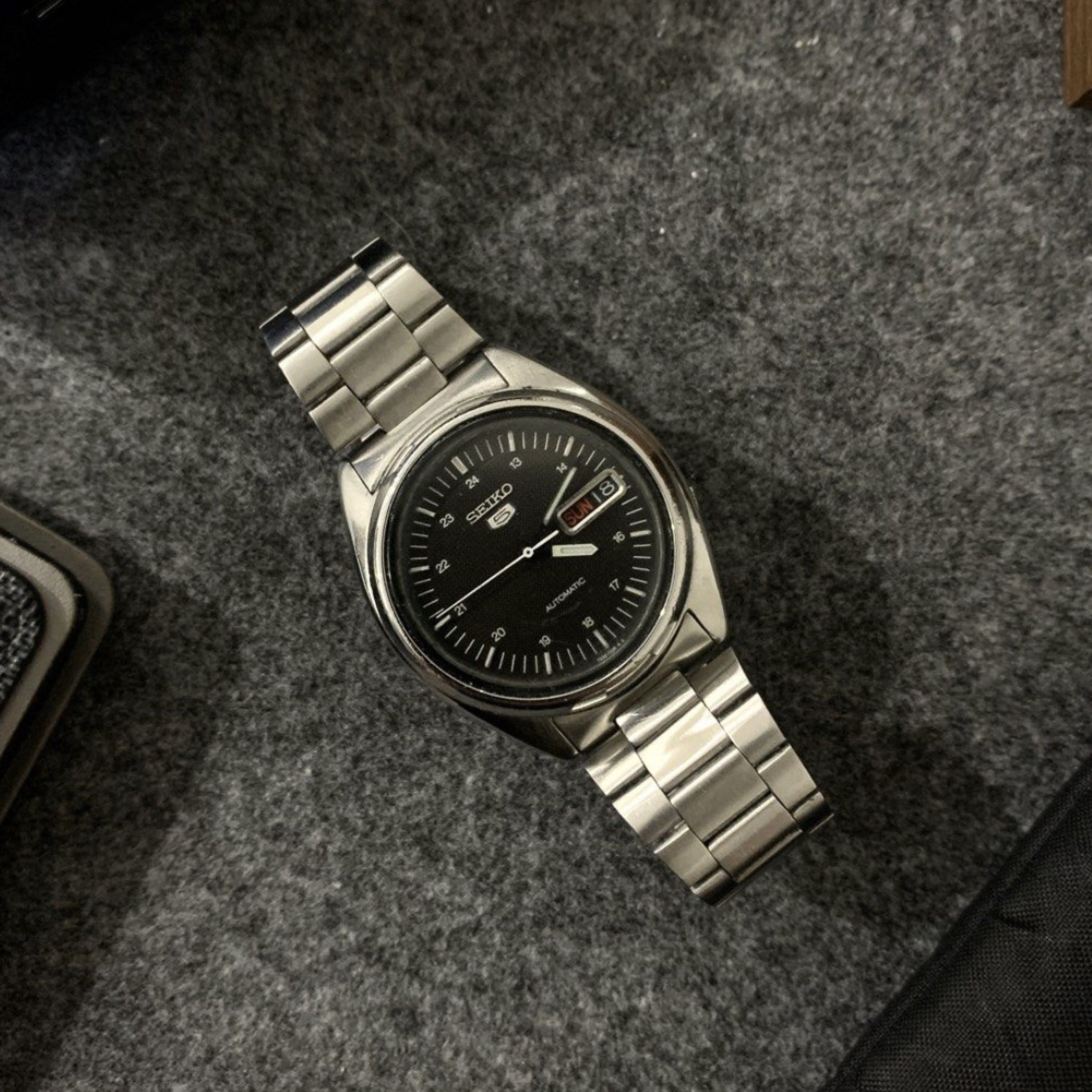Seiko 5 Automatic Watch (Category: Men's Watches) located in Manila. Submitted by 99rocket (Listing ID 1418496998, Image 2). Description: Seiko 5 Black Modern Military Waffle Dial Caliber 6309 Ref # 7009-876A Automatic Movement Bracelet fits up to 6.5 inches on wrist BMBY 1988 38mm Luminous Hands Automatic Movement All Original Parts Excellent Running Condition Newly Serviced Newly Buffed / Polished Ready to Wear, Nothing to Fix Issue: not workin
