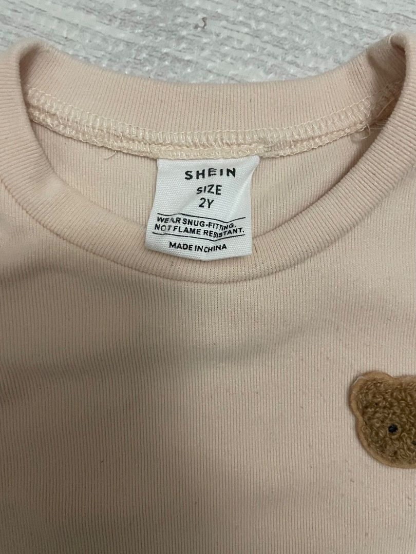 Shein 2Y Bear Applique Top and Pants Set (Category: Babies & Kids Fashion) located in Casiguran. Submitted by roseromano (Listing ID 1418430503, Image 3). Description: - Shein 2Y clothing set - Includes short-sleeved top with bear applique and matching pants - Available in beige and brown - Snug fit design - Made in China - Not flame resistant Take all.