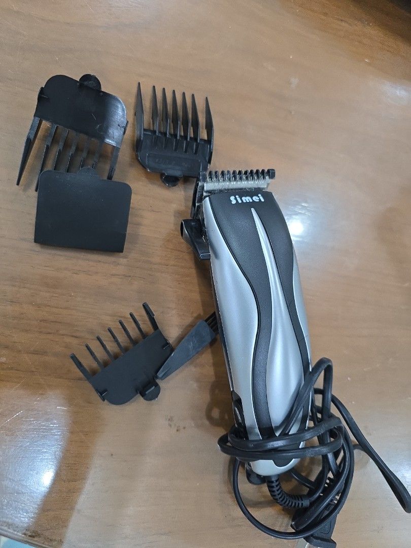 Simei SM-703 Hair Clipper (Category: Men's Grooming) located in Valenzuela. Submitted by mluck (Listing ID 1418444529, Image 2). Description: - Simei SM-703 Hair Clipper - Stainless steel blade - Adjustable cutting control lever - Super quiet operation - Powerful and reliable - High performance and stability - Includes accessories - 12W power.
