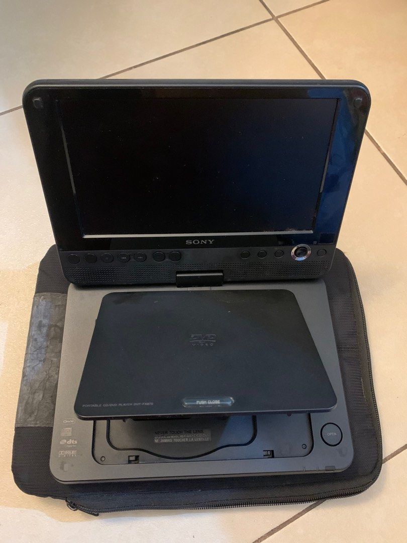 Sony Portable DVD Player (with Carry Case & Extra Battery) (Category: Printers, Scanners & Copiers) located in Taguig. Submitted by igeovaaan (Listing ID 1418512571, Image 1). Description: Sony Portable DVD Player (with Carry Case & Extra Battery) Selling an original Sony Portable DVD Player Working condition: Unsure since I have never tested it What’s included (as shown in photos): • Sony Portable DVD Player • Extra detachable battery • Sony car