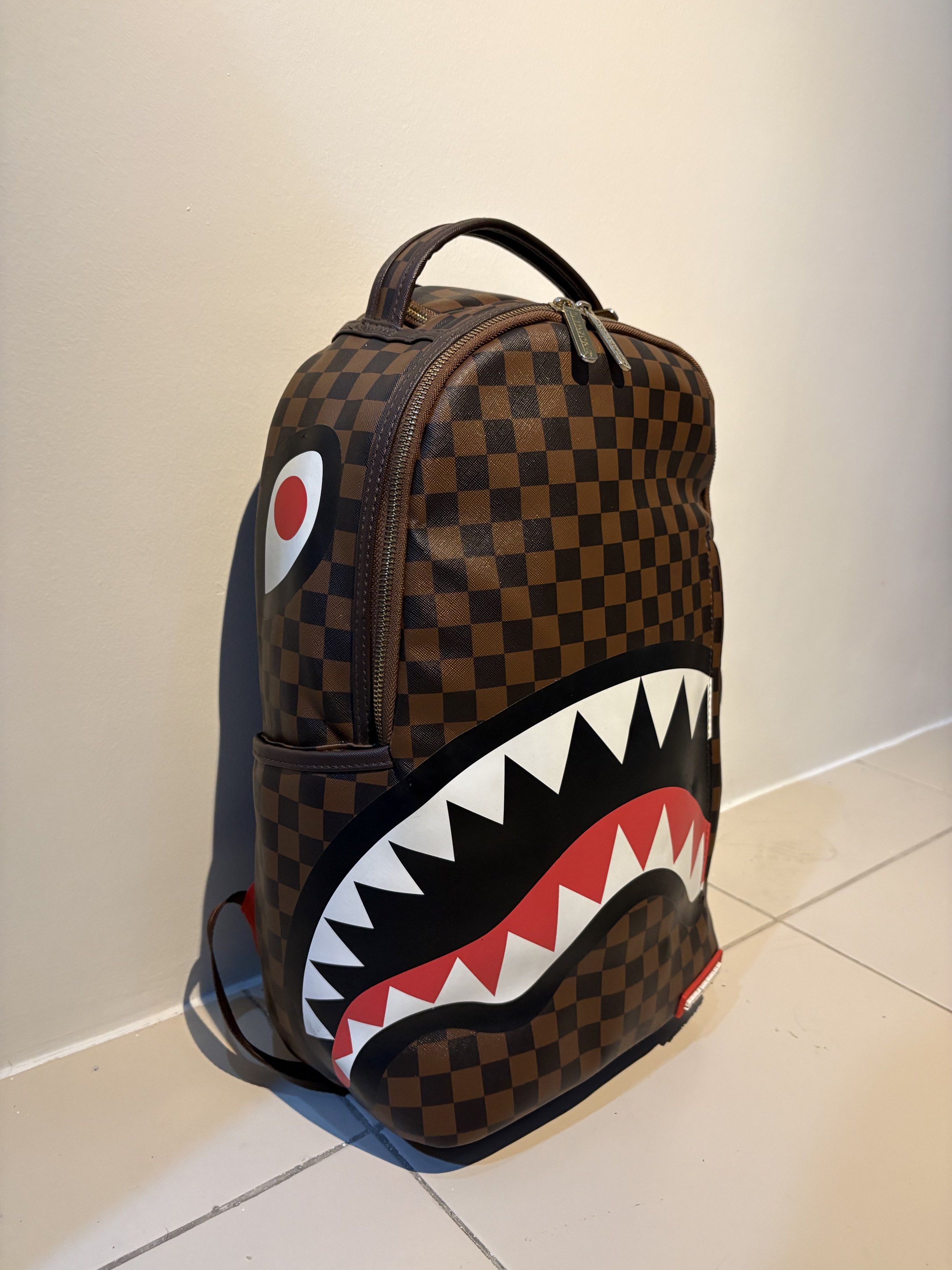 Sprayground Backpack (Category: Backpacks) located in Manila. Submitted by spiceverythingnice (Listing ID 1418427103, Image 2). Description: 100% Authentic Sprayground Sleek Sharks in Paris Brown Backpack 📍Manila.
