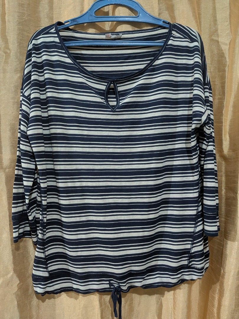 Striped Top with Keyhole Detail (Category: Others Tops) located in Quezon City. Submitted by stuff.decluttered (Listing ID 1418545183, Image 1). Description: - Classic navy and white striped pattern - Keyhole neckline detail - Three-quarter sleeves - Drawstring hem - Lightweight fabric - Ideal for casual wear.