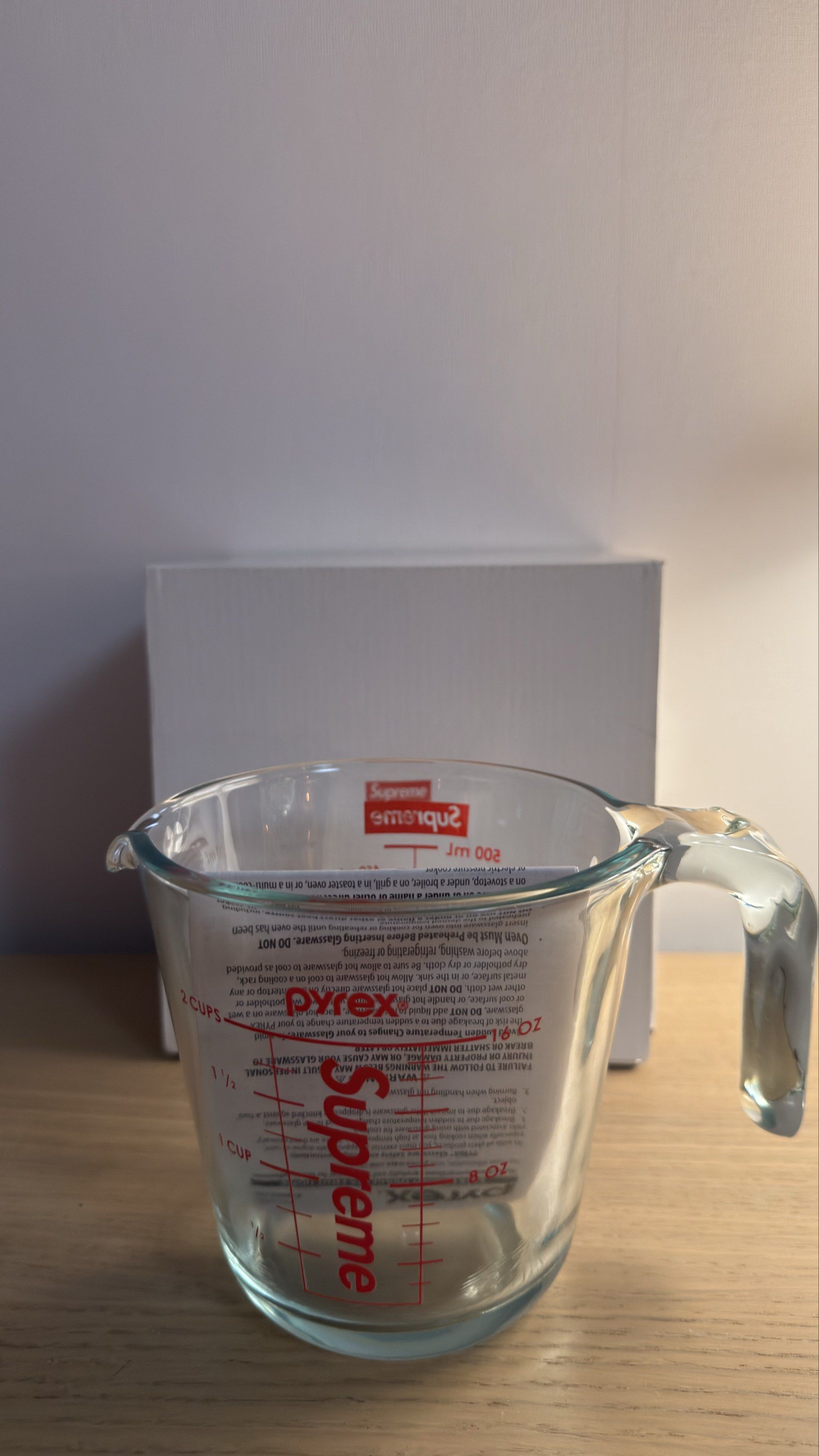 Supreme Pyrex Measuring Cup (Category: Bakeware) located in San Juan City. Submitted by fritzgeraldb (Listing ID 1418559813, Image 2). Description: - Supreme branded Pyrex measuring cup - Red measurement markings (ml and cups) - Features a handle - Capacity: 500 ml / 2 cups - Comes with original packaging.