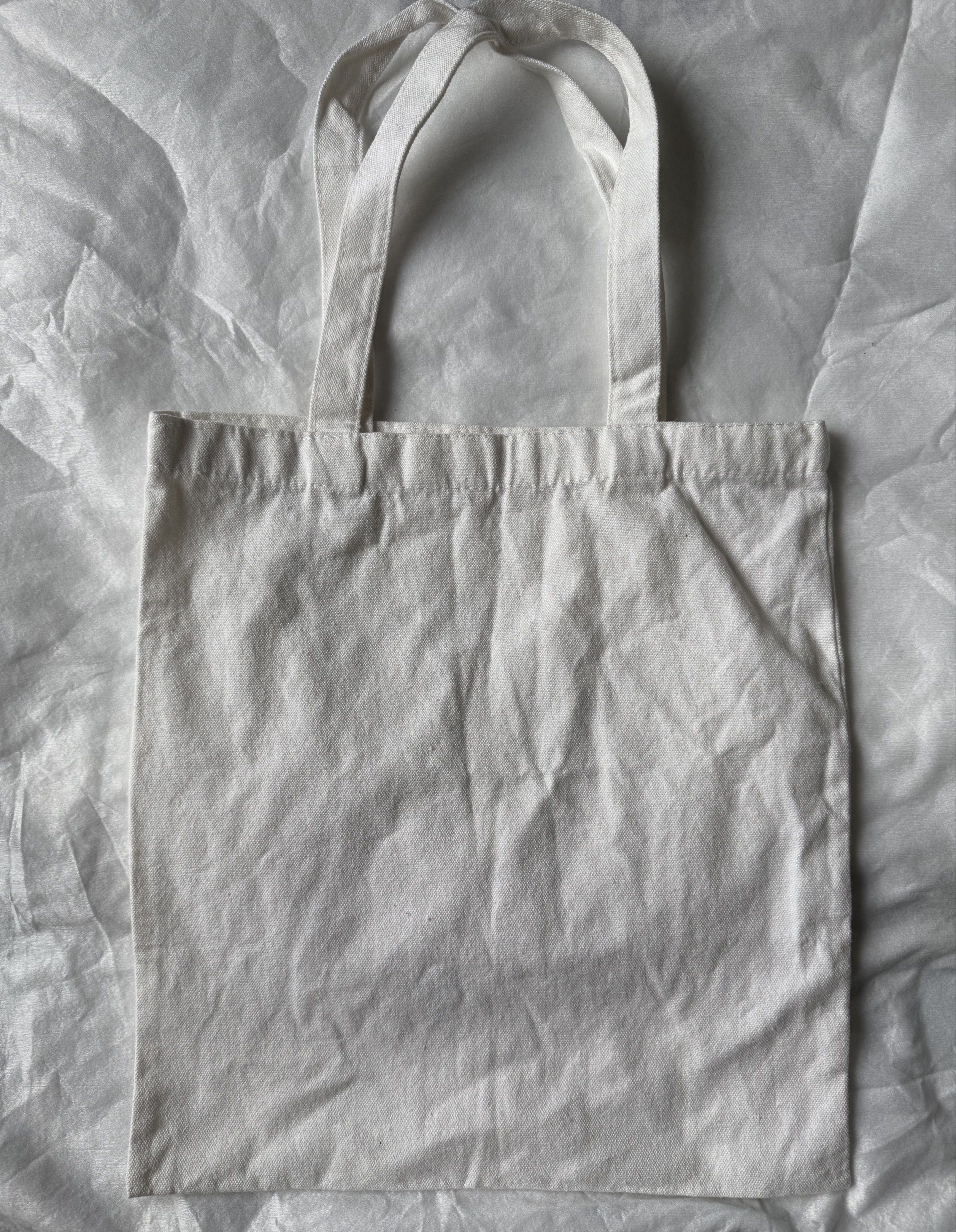 UCC Coffee Is Life Tote Bag (Category: Tote Bags) located in Manila. Submitted by stuffcartph (Listing ID 1418428689, Image 2). Description: RFS DECLUTTER - Coffee is Life tote bag - Features a white background - Maroon coffee bean graphic - Includes the UCC logo - Made of durable canvas material - Convenient two handles for carrying.