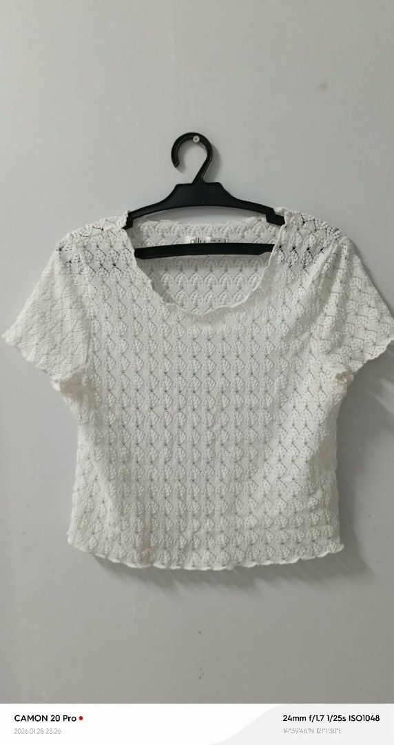 White Crochet Top (Category: Sleeveless) located in Quezon City. Submitted by sheila0721 (Listing ID 1418465119, Image 3). Description: - White crochet top - Short sleeves - Round neckline - Scalloped hem - Textured, open-weave design - Lightweight and breathable - Ideal for warm weather fit to S-M.