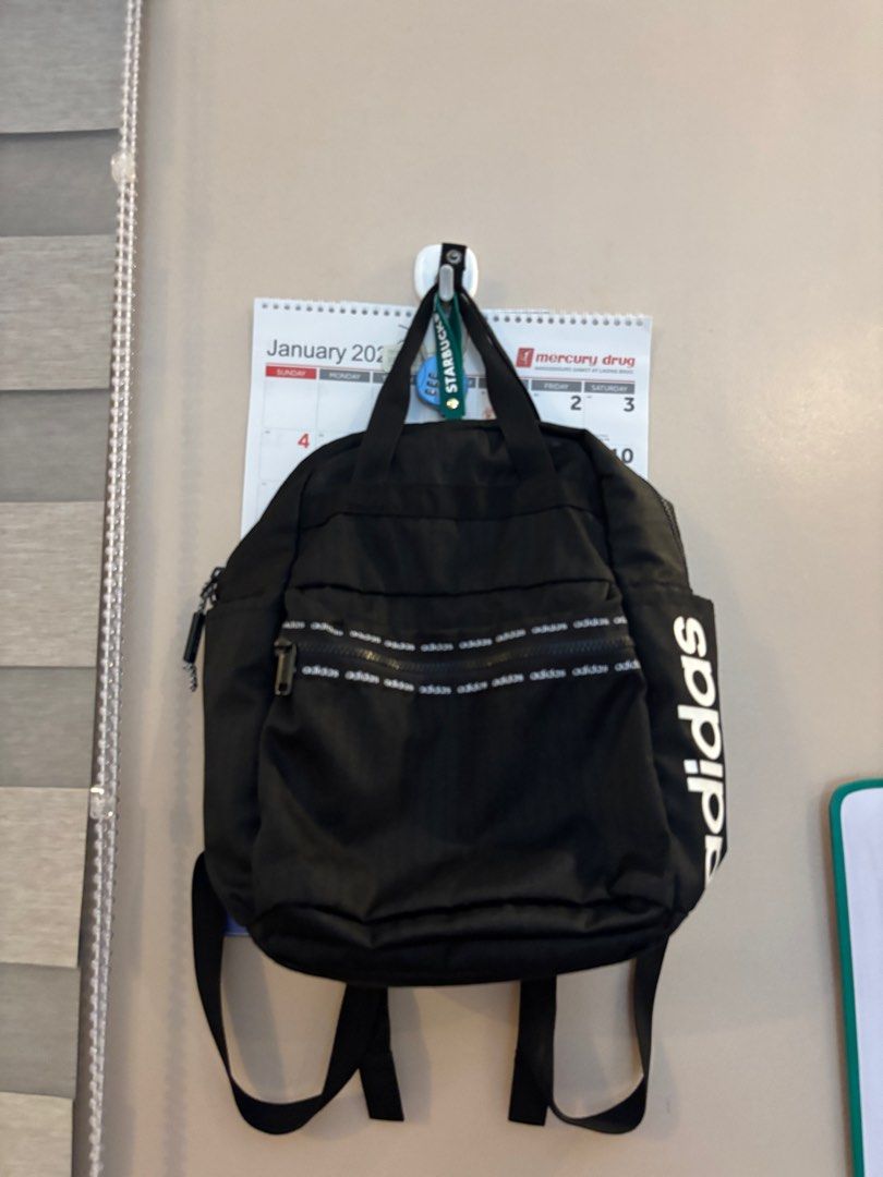Adidas Mini Backpack (Category: Backpacks) located in Manila. Submitted by coolwinddd (Listing ID 1413384809, Image 1). Description: - Black Adidas mini backpack - Main compartment with zipper - Front pocket with Adidas logo - Adjustable shoulder straps - Quilted back design - Adidas logo on the side - Ideal for everyday use.