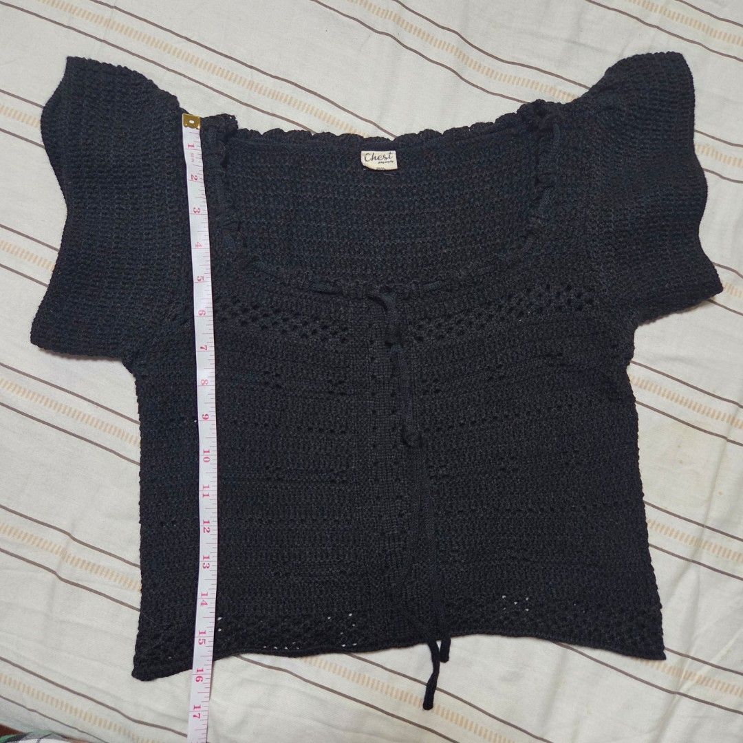 BKK Chest Black Crochet Top (Category: Sleeveless) located in Malabon City. Submitted by maracon (Listing ID 1406300955, Image 2). Description: 💯 Brand New, sinukat lang RFS: Hindi bagay sa mataba kong braso 🥲 📏 Sizes - Length: 16 inches - Bust: ○ 30 inches (Relaxed) ○ 36 inches (Max ○ 34 (Recommended fit) - Shoulder width: 13 inches (Left to Right) - Black crochet top - Square neck - Textured, open-weave material.
