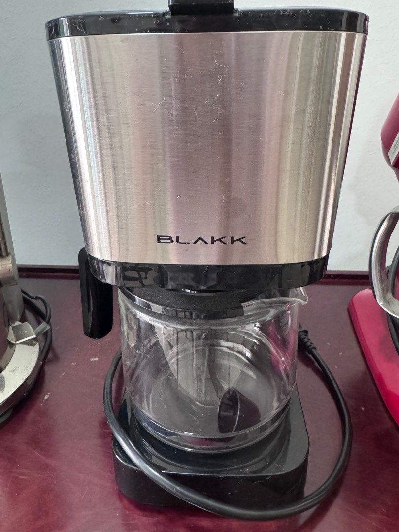 Blakk Coffee Maker (Category: Coffee Machines & Makers) located in Manila. Submitted by decluterthings888 (Listing ID 1413292039, Image 1). Description: - Blakk coffee maker - Stainless steel finish - Clear glass carafe - Black base - Visible power cord - "Blakk" brand logo.