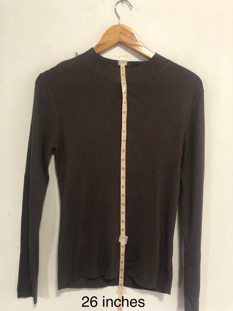 Brown Ribbed Long Sleeve Sweater (Category: Longsleeves) located in San Pedro. Submitted by offspaces__ (Listing ID 1413320366, Image 3). Description: - Brown ribbed long sleeve sweater - Mock neck - Fitted silhouette - Measurements: - Waist: 15.5 inches - Sleeve Length: 25.5 inches - Length: 26 inches - Versatile for layering or wearing alone.