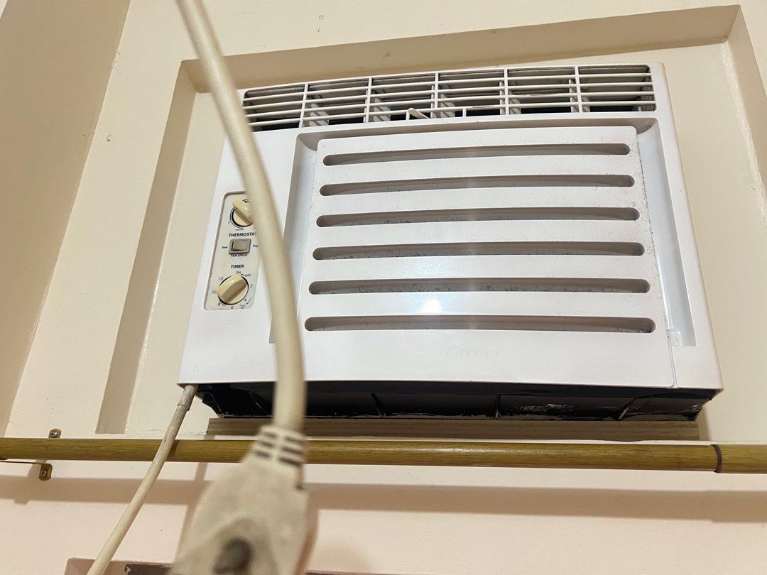 Non-inverter Carrier Window Type Air Conditioner 0.75hp (Category: Air Conditioning and Heating) located in Quezon City. Submitted by bubspreloved (Listing ID 1413270321, Image 2). Description: - Window-type air conditioner not inverter - Adjustable thermostat and timer - Fan speed control (low/high) - White unit, wall-mounted - Includes power cord - Easy operation with labeled controls No remote control.