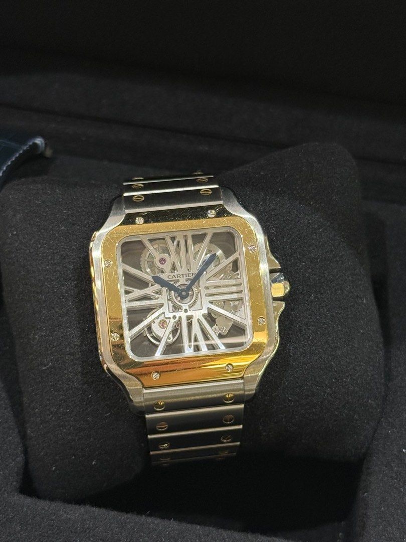 Cartier Santos Skeleton Watch (Category: Luxury Watches) located in Makati City. Submitted by itsyourwatches (Listing ID 1413258296, Image 2). Description: Cartier Santos Skeleton steel/18k yellow gold Manual Wind 39mm x 47mm ref-whsa0019 W/box, warranty card & 1 blue leather strap year 2022 .
