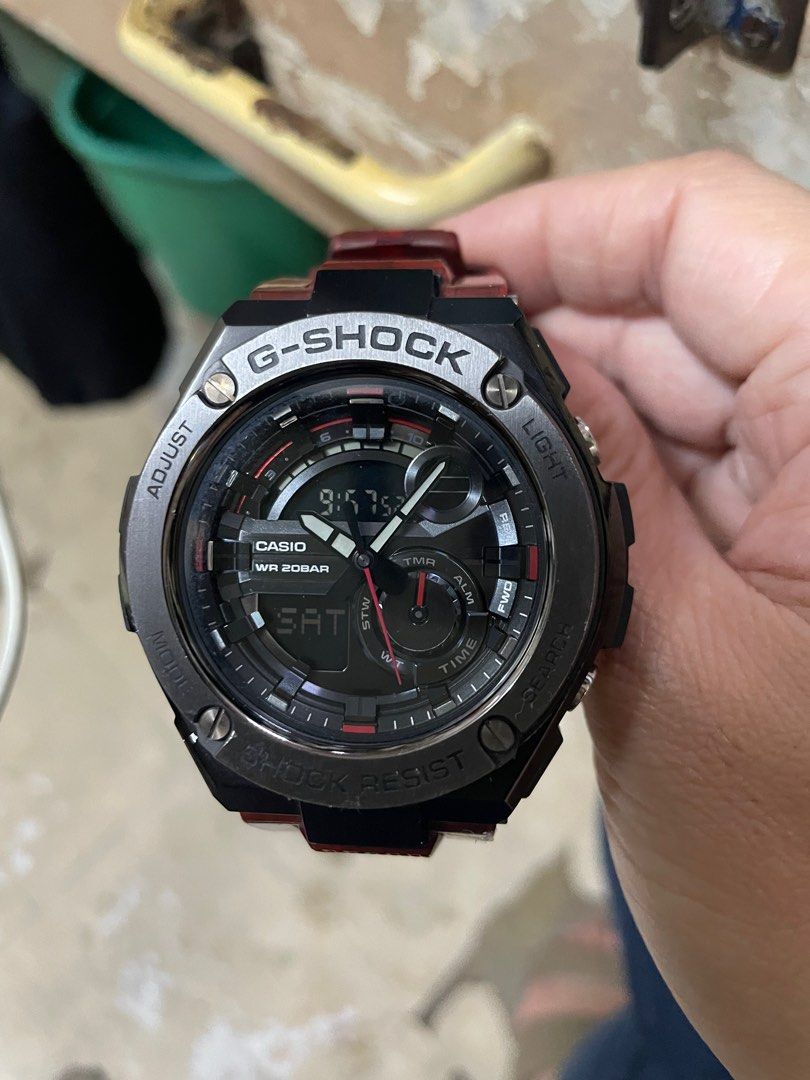 Casio G-Shock GST-210M Watch (Category: Men's Watches) located in Balanga. Submitted by jza_mery (Listing ID 1413288718, Image 1). Description: - G-Shock watch with a striking black and red design. - Features a digital display showing time, date, and alarm. - Built for durability: water-resistant and shock-resistant. - Stylish red strap with a textured finish. - Durable stainless steel bezel and a sleek black case. No issue Watch only also availa