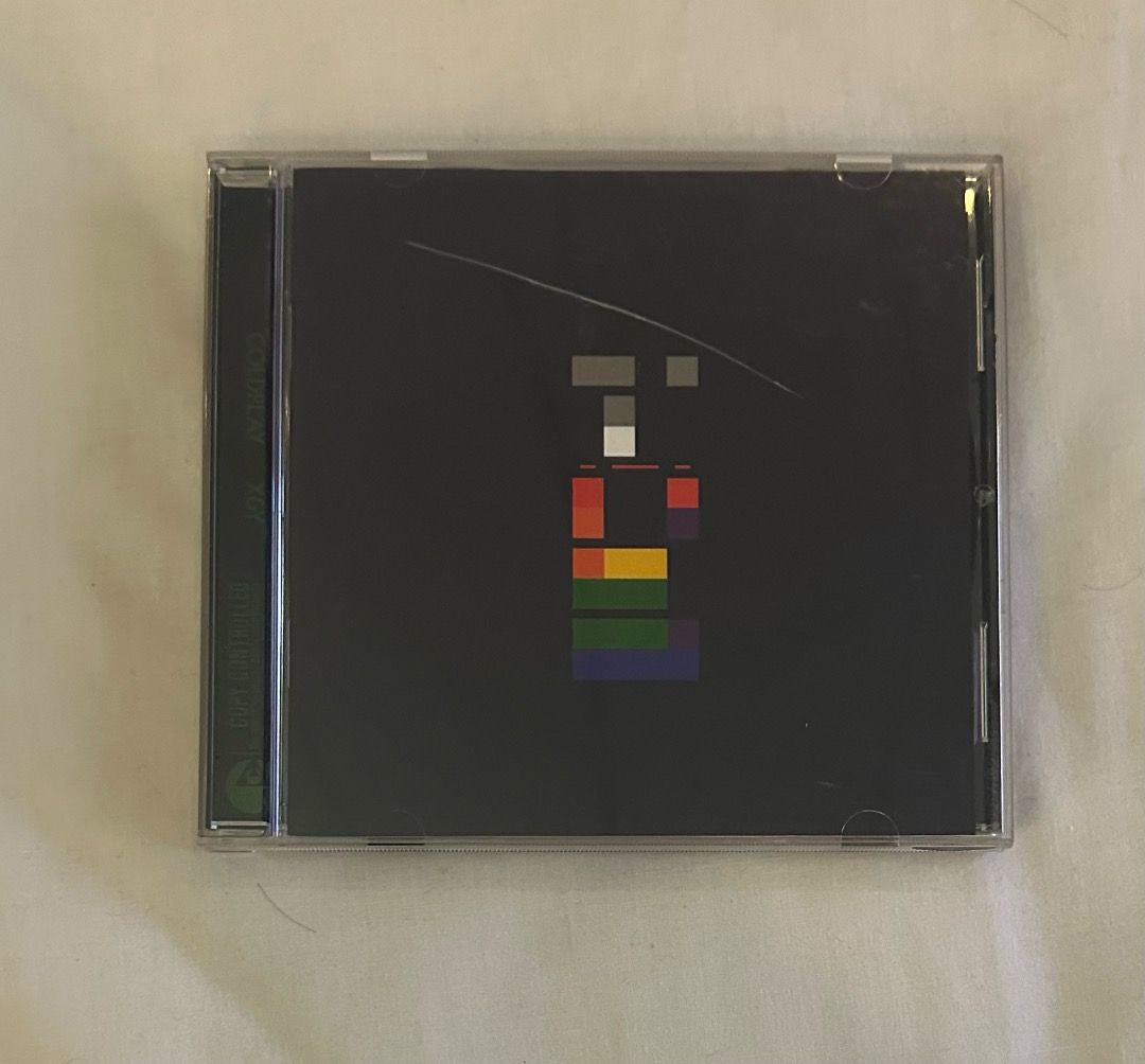 Coldplay X&Y CD (Category: CDs & DVDs) located in San Juan City. Submitted by looneybin559 (Listing ID 1413402179, Image 2). Description: - Coldplay "X&Y" CD for sale. - Features the iconic album art on a black case. - Includes the CD and case. - Tracklist includes "Square One", "Speed of Sound", and more. - CD is visible inside the case. Like New. Hard to Find CD. In Good Condition. WYSIWYG. ***ITEM IS AVAILABLE IF YOU CAN SEE THIS MESSAGE. Paym