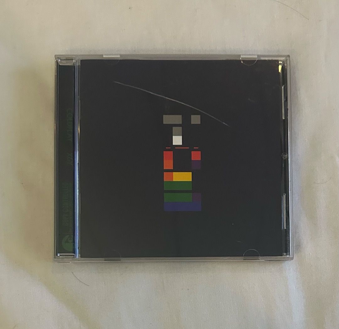 Coldplay X&Y CD (Category: CDs & DVDs) located in San Juan City. Submitted by looneybin559 (Listing ID 1413402179, Image 1). Description: - Coldplay "X&Y" CD for sale. - Features the iconic album art on a black case. - Includes the CD and case. - Tracklist includes "Square One", "Speed of Sound", and more. - CD is visible inside the case. Like New. Hard to Find CD. In Good Condition. WYSIWYG. ***ITEM IS AVAILABLE IF YOU CAN SEE THIS MESSAGE. Paym