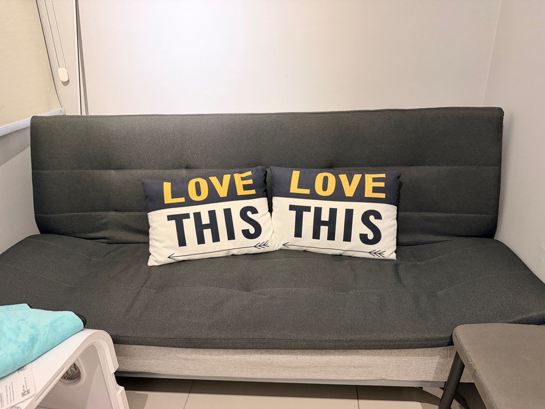 Convertible Sofa Bed (Category: Sofas) located in Seri Kembangan. Submitted by kimnws (Listing ID 1413398021, Image 1). Description: - Dark grey sofa bed with light grey base - Includes pillows - Modern design with chrome legs - Suitable for living room or guest room.