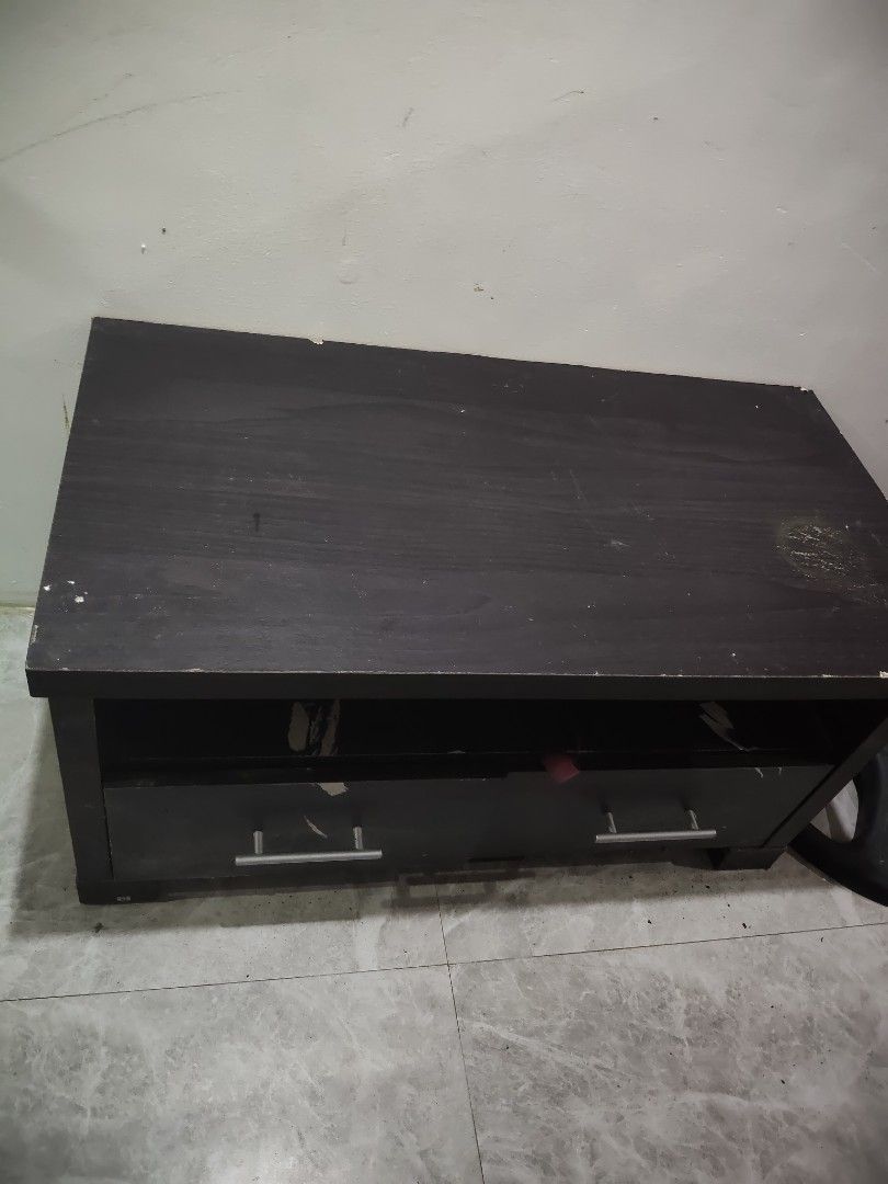 Dark Brown TV Stand with Drawers (Category: TV Consoles) located in Quezon City. Submitted by cherry018 (Listing ID 1413394005, Image 2). Description: - Dark brown wooden TV stand - Two drawers with silver handles - Open shelf for storage - Rectangular shape - Ideal for TVs - Provides storage for media devices.