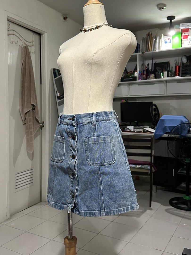 Denim Button A-line High Waist Skirt (Category: Skirts) located in Caloocan City. Submitted by 444keeps (Listing ID 1413340769, Image 3). Description: High quality hard denim! Some of the buttons have stains (see photos) W: 30 in L: 15.5 in .