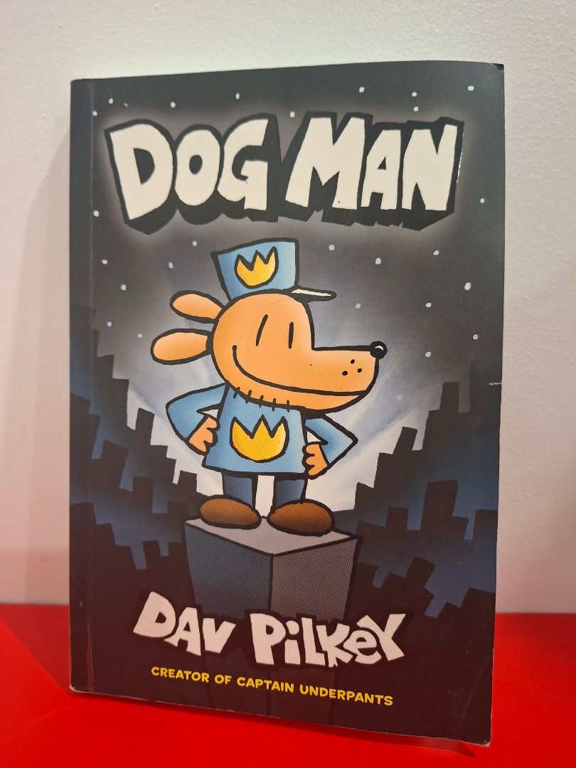 Dog Man by Dav Pilkey (Category: Comics & Manga) located in Pasig City. Submitted by loisegems (Listing ID 1413376559, Image 1). Description: - "Dog Man" by Dav Pilkey - Features the Dog Man character in a police uniform on the cover. - Contains colorful comic illustrations. - with name on the inner cover.