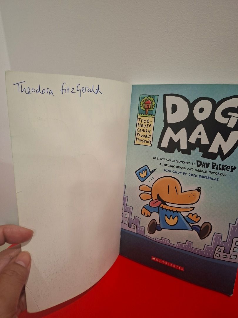 Dog Man by Dav Pilkey (Category: Comics & Manga) located in Pasig City. Submitted by loisegems (Listing ID 1413376559, Image 2). Description: - "Dog Man" by Dav Pilkey - Features the Dog Man character in a police uniform on the cover. - Contains colorful comic illustrations. - with name on the inner cover.