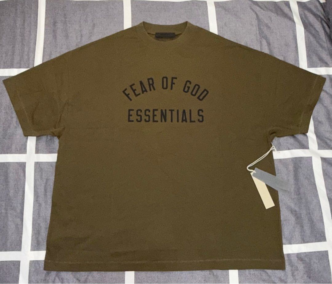 Fear of God Essentials Olive Green T-shirt (Category: Tshirts & Polo Shirts ) located in Quezon City. Submitted by ramearc (Listing ID 1413264851, Image 1). Description: - Fear of God Essentials T-shirt - Color: Olive - Size: L fits up to XXL (Super oversized) - Includes original tags and packaging - Original Price: 3,890 PHP - RFS : Wrong size and can’t be returned, with small oil stain.