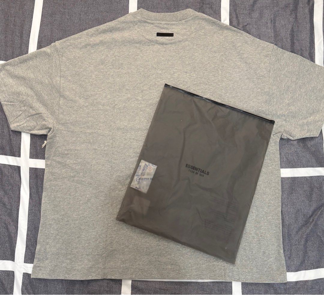 Fear of God Essentials T-shirt (Category: Tshirts & Polo Shirts ) located in Quezon City. Submitted by ramearc (Listing ID 1413262872, Image 3). Description: - Fear of God Essentials T-shirt - Color: Grey - Size: L fits up to XXL (Super oversized) - Includes original tags and packaging - Original Price: 3,890 PHP - RFS : Wrong size and can’t be returned.