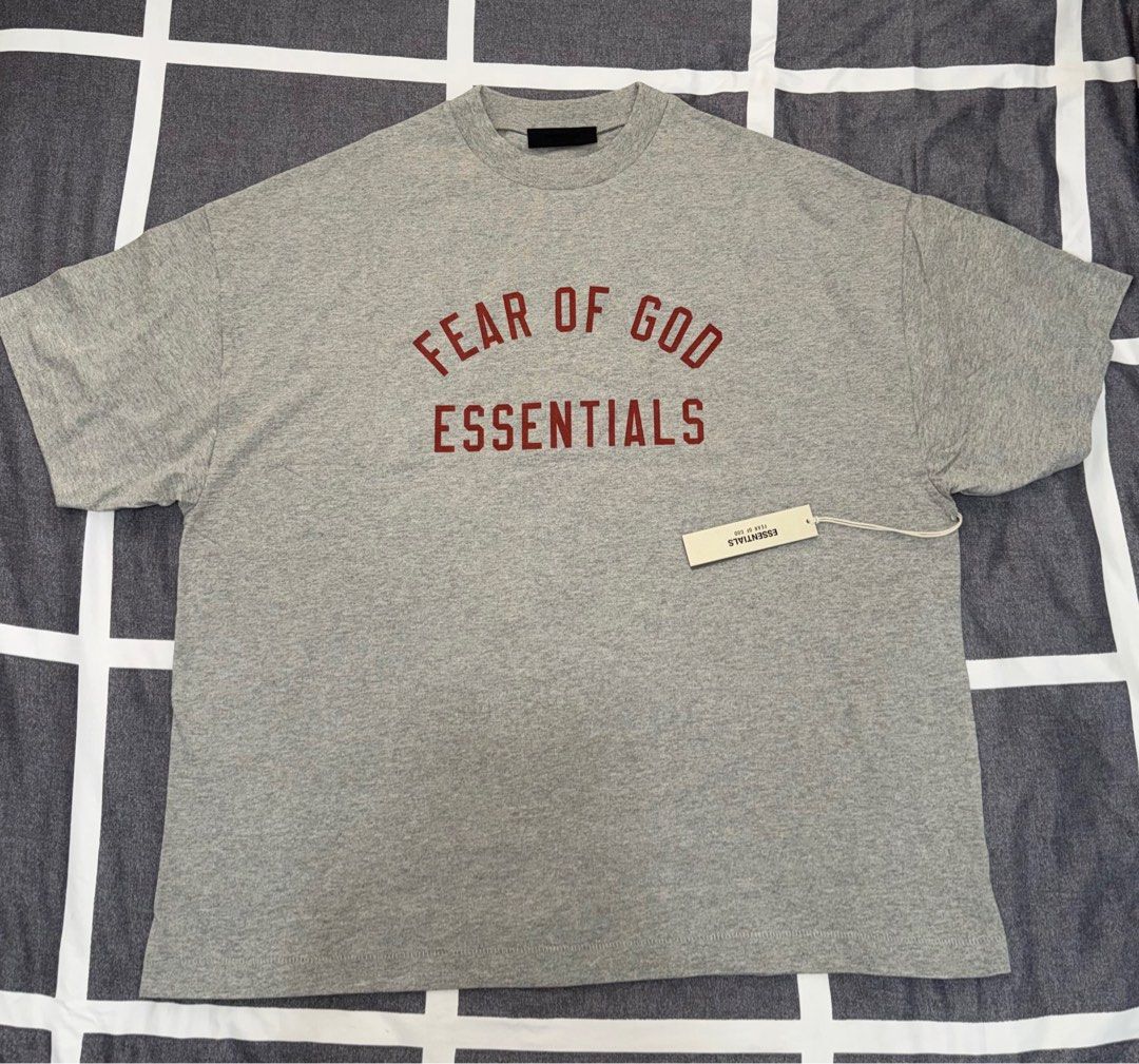 Fear of God Essentials T-shirt (Category: Tshirts & Polo Shirts ) located in Quezon City. Submitted by ramearc (Listing ID 1413262872, Image 1). Description: - Fear of God Essentials T-shirt - Color: Grey - Size: L fits up to XXL (Super oversized) - Includes original tags and packaging - Original Price: 3,890 PHP - RFS : Wrong size and can’t be returned.