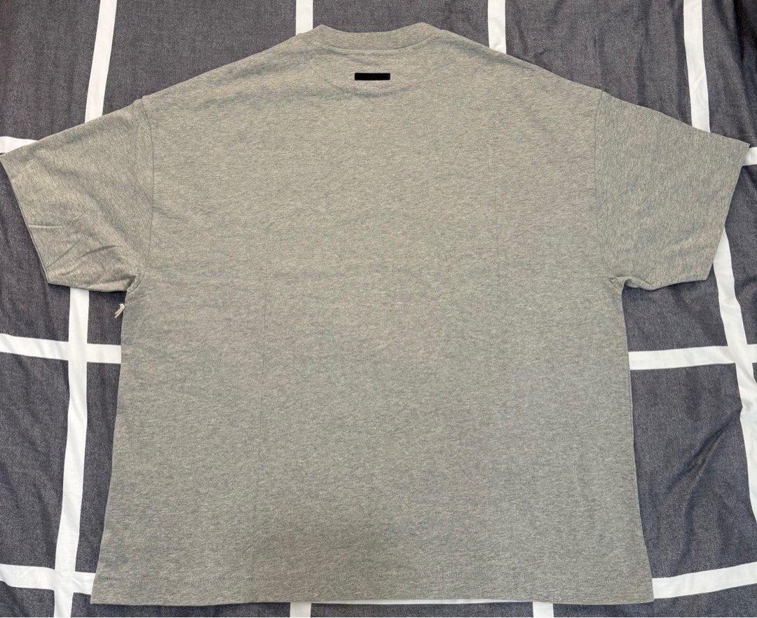 Fear of God Essentials T-shirt (Category: Tshirts & Polo Shirts ) located in Quezon City. Submitted by ramearc (Listing ID 1413262872, Image 2). Description: - Fear of God Essentials T-shirt - Color: Grey - Size: L fits up to XXL (Super oversized) - Includes original tags and packaging - Original Price: 3,890 PHP - RFS : Wrong size and can’t be returned.