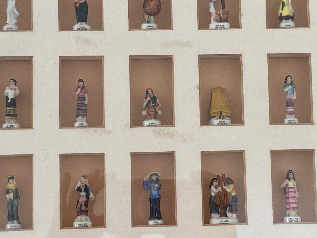 Framed Miniature Vietnam Figurine Collection (Category: Vintage Collectibles) located in General Trias. Submitted by csrtechsol61982 (Listing ID 1413398982, Image 2). Description: - Framed collection of miniature figurines. - Features people in various traditional outfits. - Displayed in a brown shadow box. - Gold-colored frame border. - Well-preserved condition..
