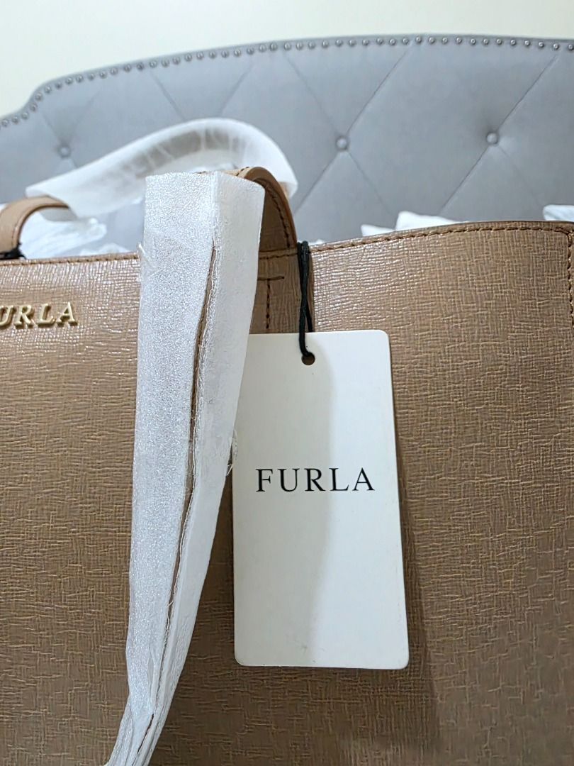 Furla Tote/Laptop Bag (Category: Luxury Bags & Wallets) located in Taguig. Submitted by iamloulouvi (Listing ID 1413283523, Image 3). Description: FOR SERIOUS BUYERS ONLY - Brand new Furla laptop tote bag - Includes original tag, original dust bag - H14" x L12" x W5" - Bought at Saks Fifth Ave in Boston, MA - Retails for $378 plus tax or > P23,000. Selling at a bargain, please be realistic with your expectation of how much you can negotiate the p