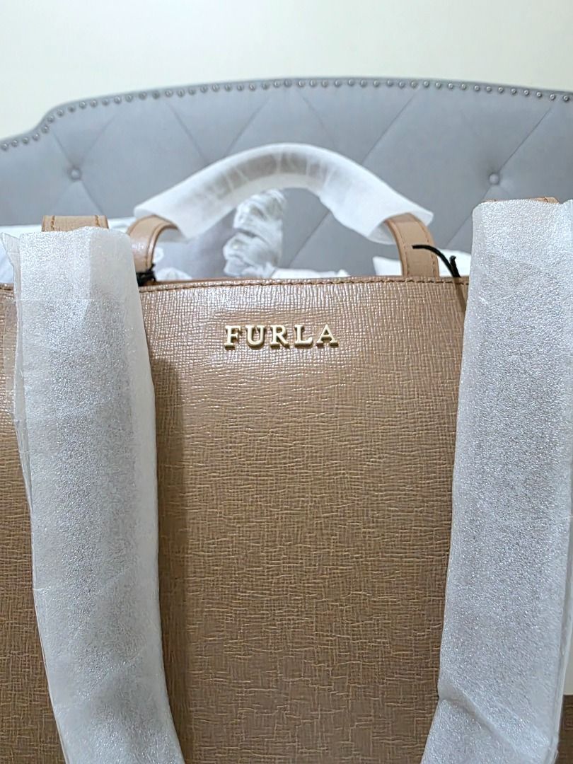 Furla Tote/Laptop Bag (Category: Luxury Bags & Wallets) located in Taguig. Submitted by iamloulouvi (Listing ID 1413283523, Image 2). Description: FOR SERIOUS BUYERS ONLY - Brand new Furla laptop tote bag - Includes original tag, original dust bag - H14" x L12" x W5" - Bought at Saks Fifth Ave in Boston, MA - Retails for $378 plus tax or > P23,000. Selling at a bargain, please be realistic with your expectation of how much you can negotiate the p