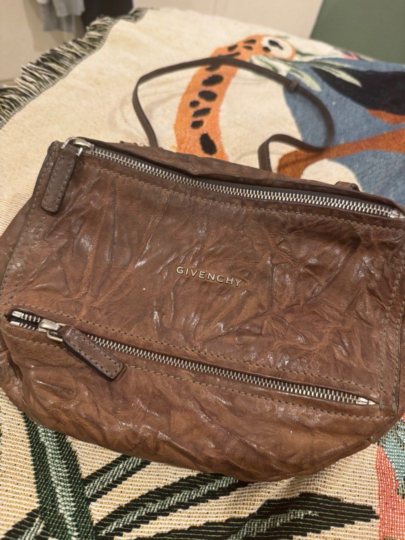 Givenchy Pandora Mini Bag (Category: Luxury Bags & Wallets) located in Taguig. Submitted by mhay.molina (Listing ID 1413350838, Image 1). Description: ALL MUST GO!!! LAST PRICE POSTED - Authentic Givenchy Pandora Mini bag - Brown leather - Silver-tone hardware - Top zip closure - Includes dust bag and original receipt - Shoulder strap - Givenchy logo on front - Made in Italy.