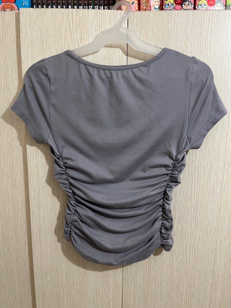 Gray Cinched / Ruched T-Shirt (Category: Shirts) located in Pasig City. Submitted by dinnerrollss (Listing ID 1413382346, Image 1). Description: Gray Cinched / Ruched Shirt 📏 SIZE: XS to S ✔️ RFS: Decluttering ✔️ Original Price: Php 208 🌟‼️ Buy 3 or more items, get 10% off.