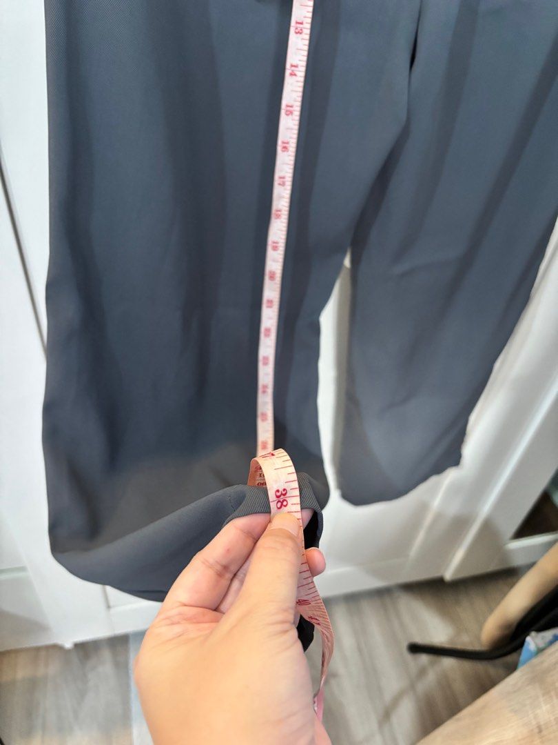 Gray Wide Leg Pants (Category: Other Bottoms) located in Pasay City. Submitted by averycontent (Listing ID 1413279321, Image 3). Description: - Gray wide-leg pants - Elastic waistband & button closure - Pleated front - Pockets - Straight leg - Lightweight fabric - length: Approximately 38 inches.