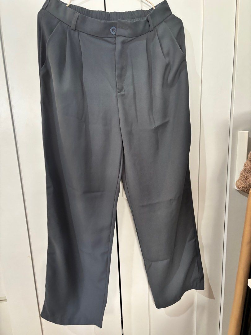 Gray Wide Leg Pants (Category: Other Bottoms) located in Pasay City. Submitted by averycontent (Listing ID 1413279321, Image 1). Description: - Gray wide-leg pants - Elastic waistband & button closure - Pleated front - Pockets - Straight leg - Lightweight fabric - length: Approximately 38 inches.