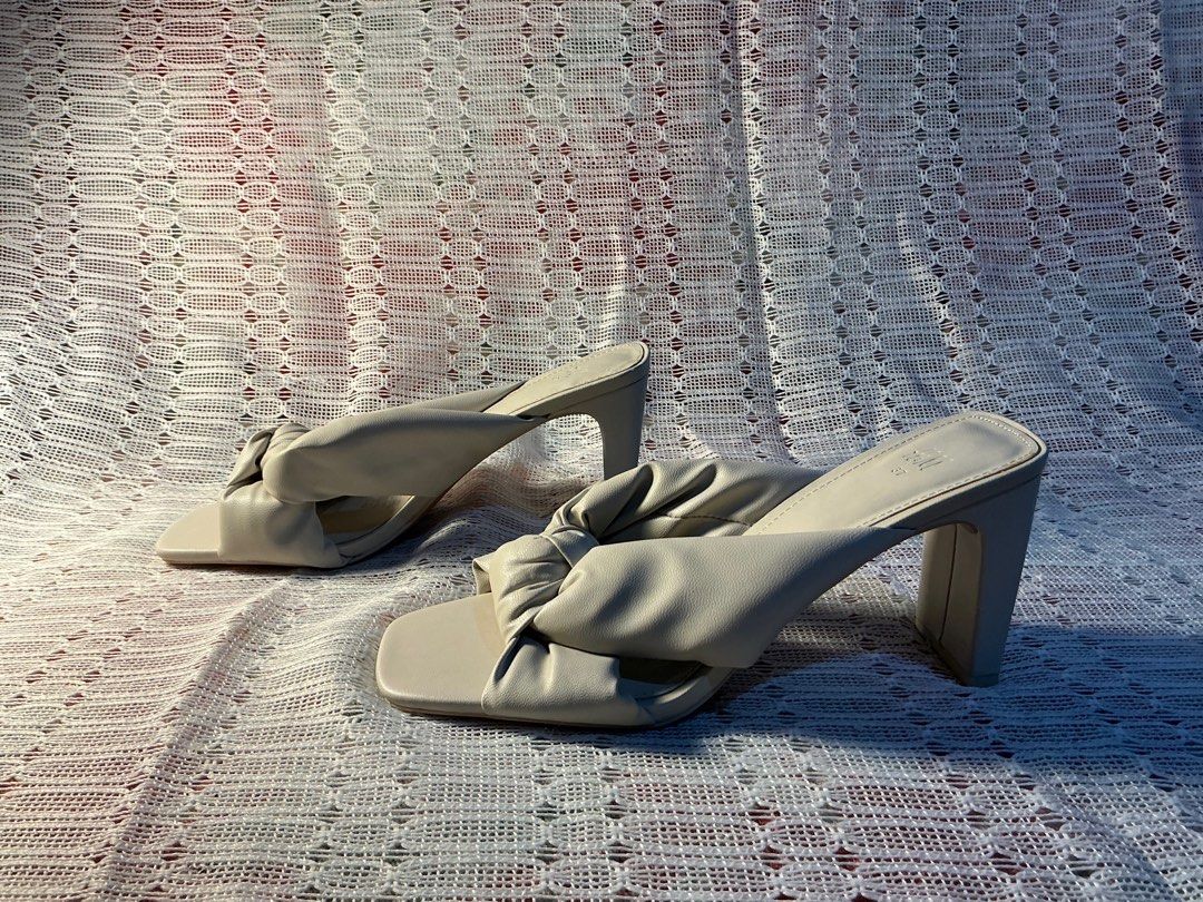 H&M White Heeled Sandals Kitten Heels (Category: Heels) located in Taguig. Submitted by ben_is_here (Listing ID 1413321784, Image 2). Description: H&M off-white sandals/kitten heels with stylish knotted strap detail Size 6 US Female Almost new condition, never been worn.