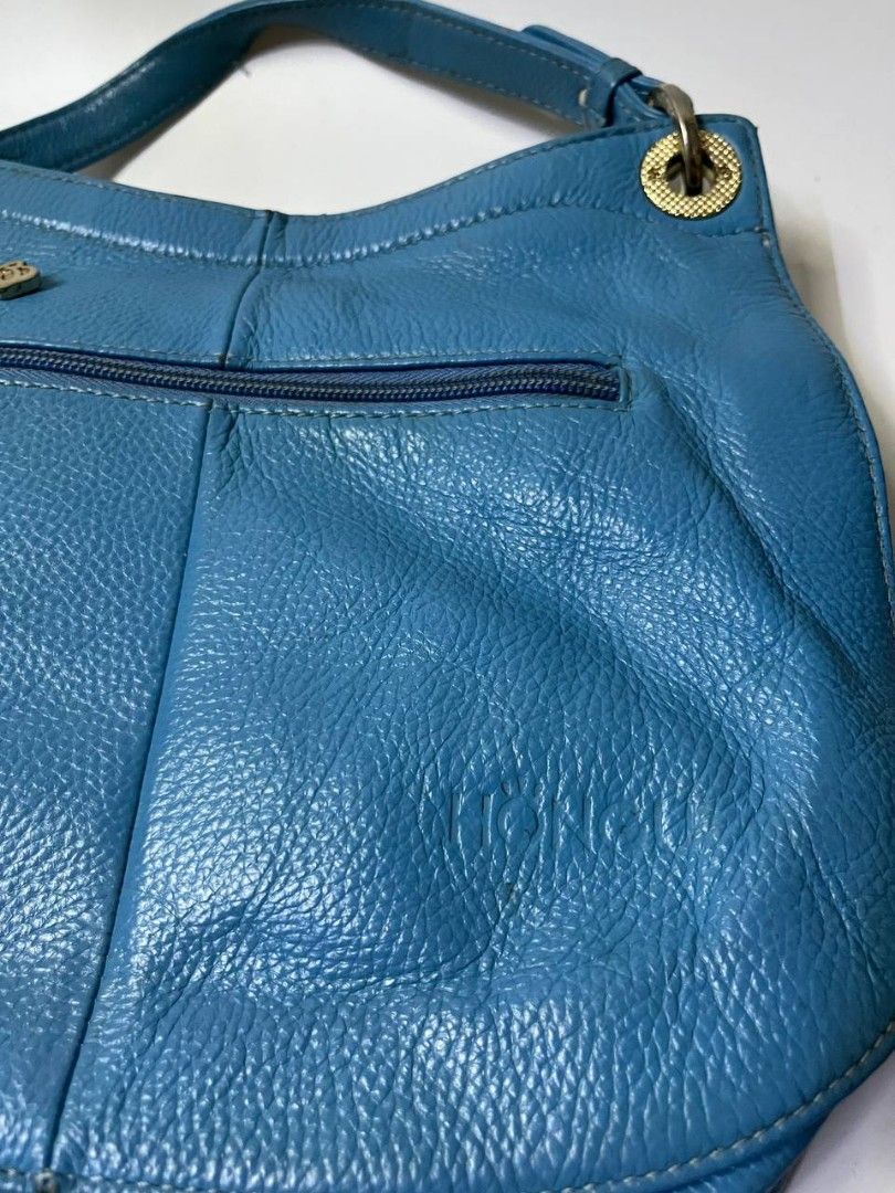 SHOULDER BAG (Category: Luxury Bags & Wallets) located in Quezon City. Submitted by alternativefinds (Listing ID 1413277150, Image 3). Description: FOR SALE Authentic Hongu luxury handbag (China). Beautiful blue hobo bag with cream flap detail, soft leather, and a roomy interior. Gently used and very stylish. PRICE:1199 LOC COMMONWEALTH QC DM TO PURCHASE AND FOR MORE DETAILS ISSUE INDICATED IN PICTURE.
