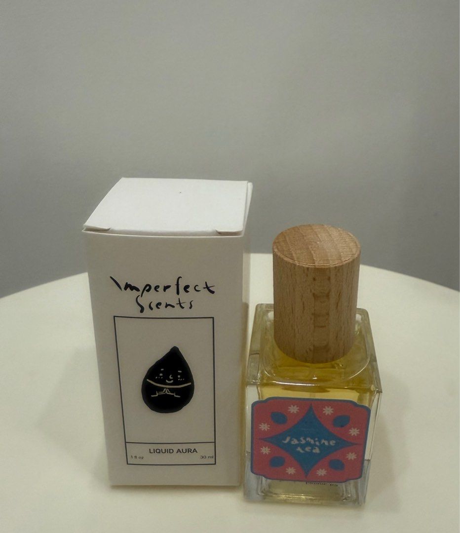 Imperfect Scents Liquid Aura Jasmine Tea (Category: Fragrance & Deodorants) located in Quezon City. Submitted by thegoodstuff_ph (Listing ID 1413285587, Image 1). Description: - Imperfect Scents Liquid Aura Jasmine Tea perfume - 30ml / 1 fl oz bottle - Features a wooden cap - Scent: Jasmine Tea - Comes in original box Sprayed 2x to try Fresh Scent.