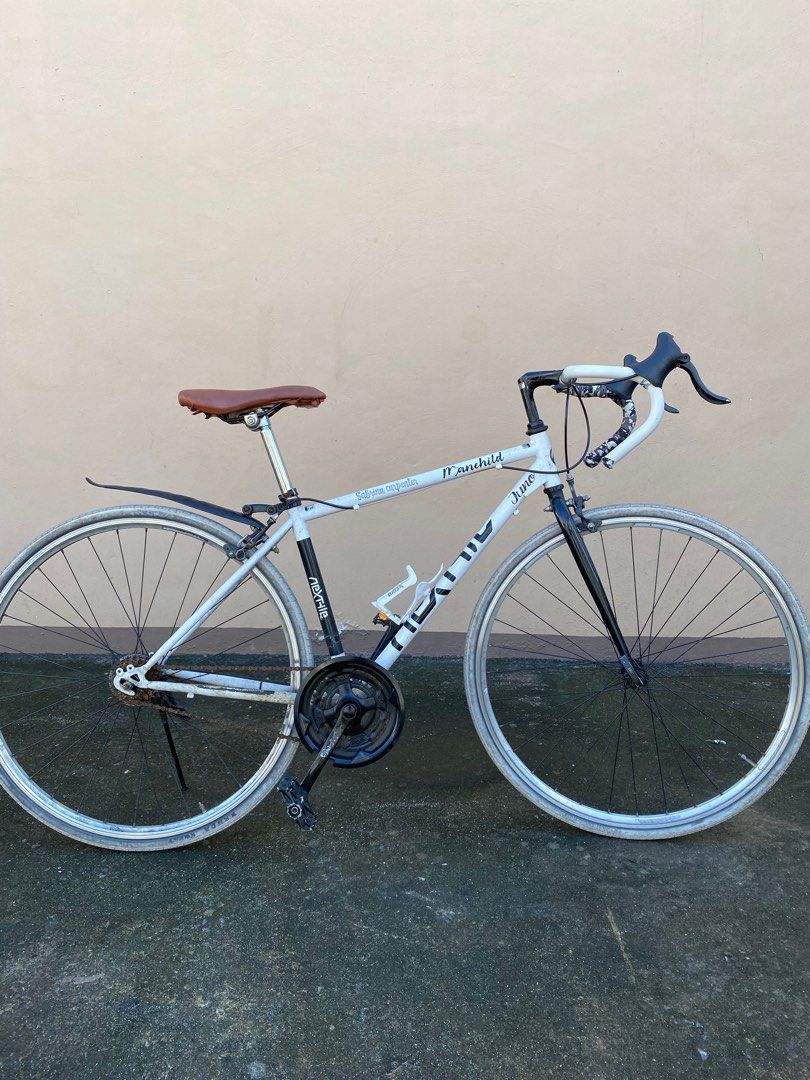 Japanese Road Bike (Category: Bicycles) located in Manila. Submitted by simple_ideas (Listing ID 1413301582, Image 3). Description: - White Nexfile Junior road bike, converted to single speed pero nandun pa rin component. Hindi na inayos at nalinis may bagong roadbike na. As is were is condition. - Drop handlebars - Brown saddle - Rear fender - Black components (fork, crankset, pedals) - 7-speed cassette - Rim brakes - White tires - Includes wate